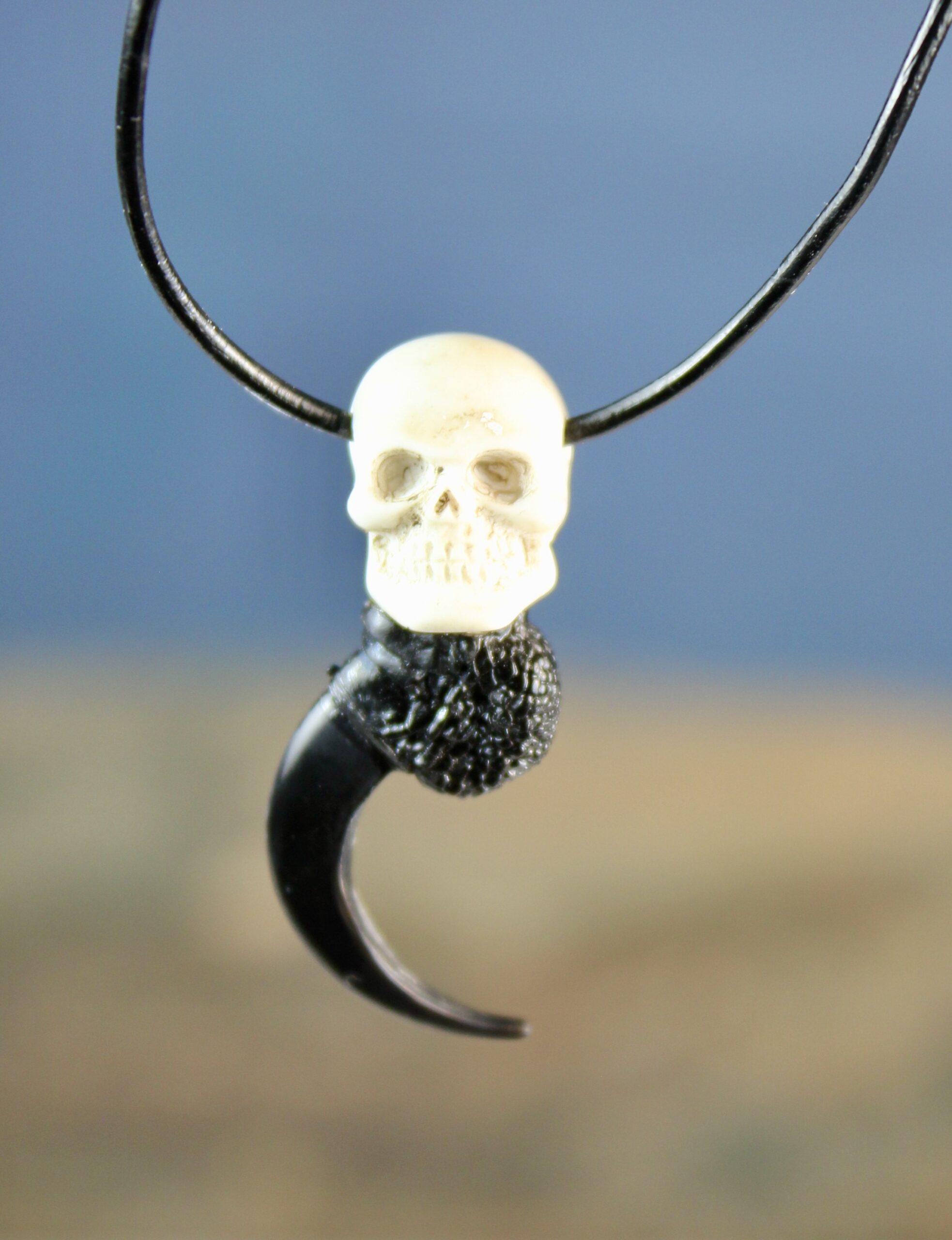Raven claw necklace with resin skull