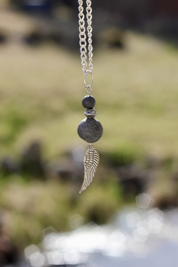 Lava stone necklace with silver-coloured wing charm