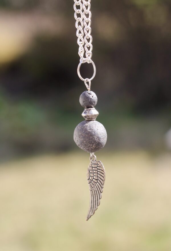 Lava stone necklace with silver-coloured wing charm - Image 6